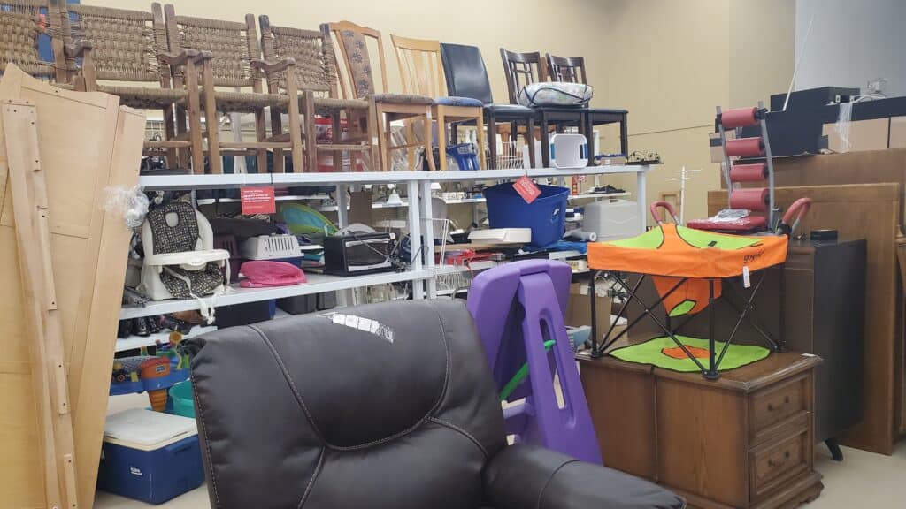 Furniture like chairs, nightstands, and sofa in a reuse store