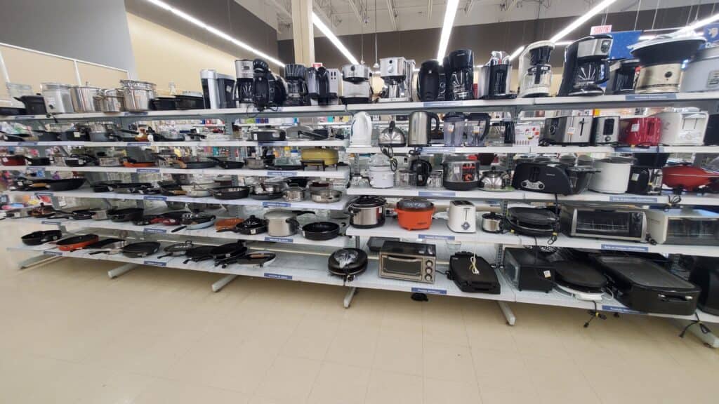 Secondhand small kitchen appliances displayed in a reuse store